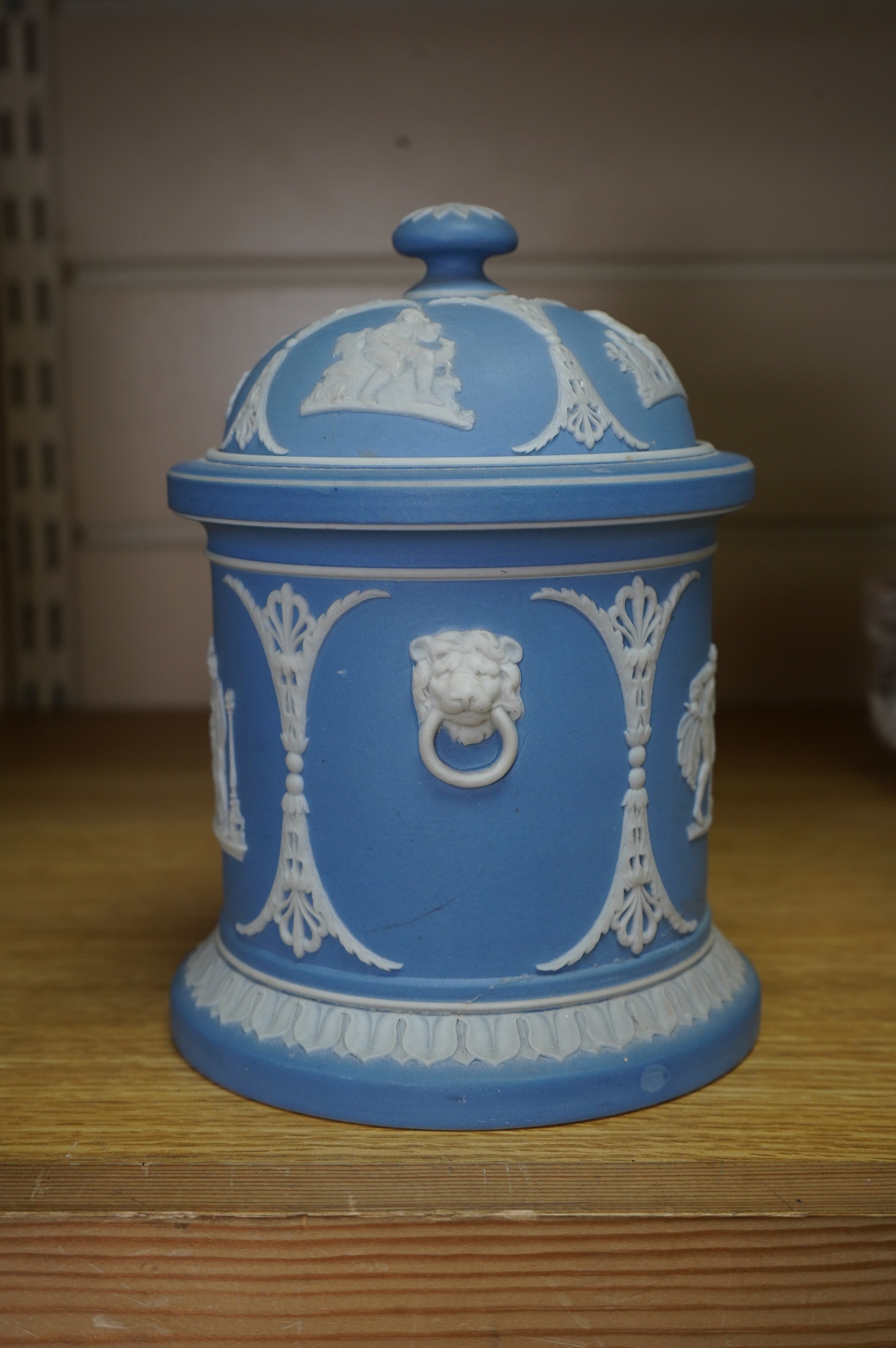 A Wedgwood jasperware tobacco jar, 17cm high. Condition - poor